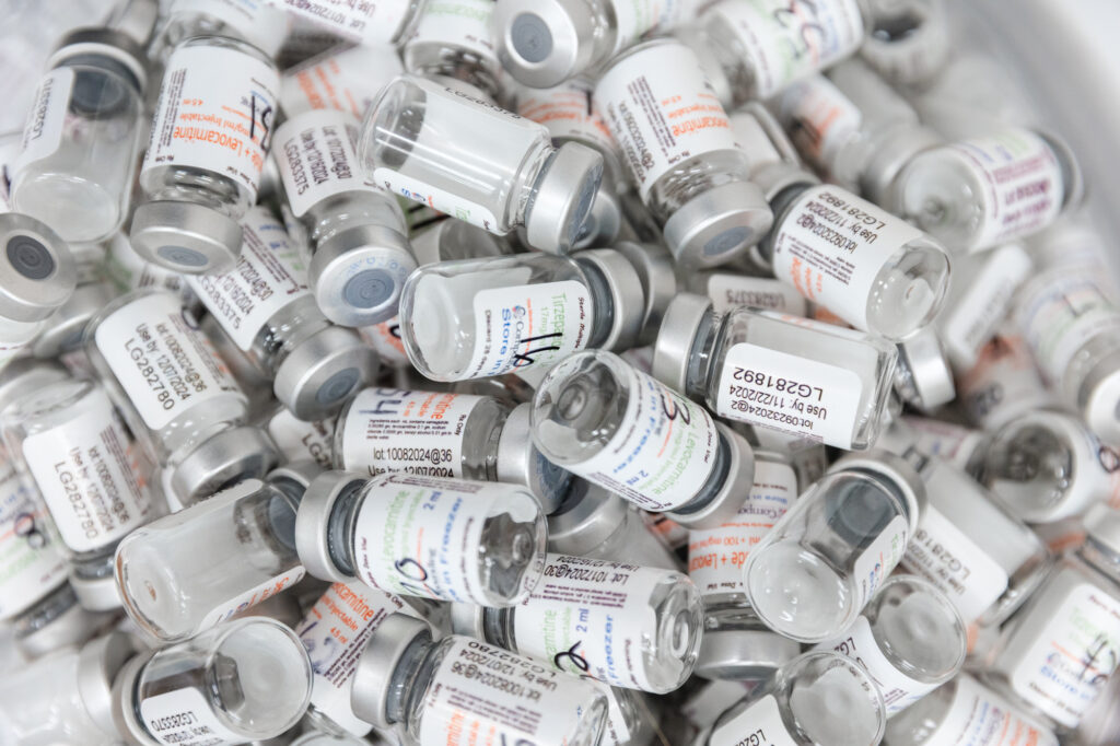 A handful of vials containing semaglutide in Oak Ridge sit in a large bin.